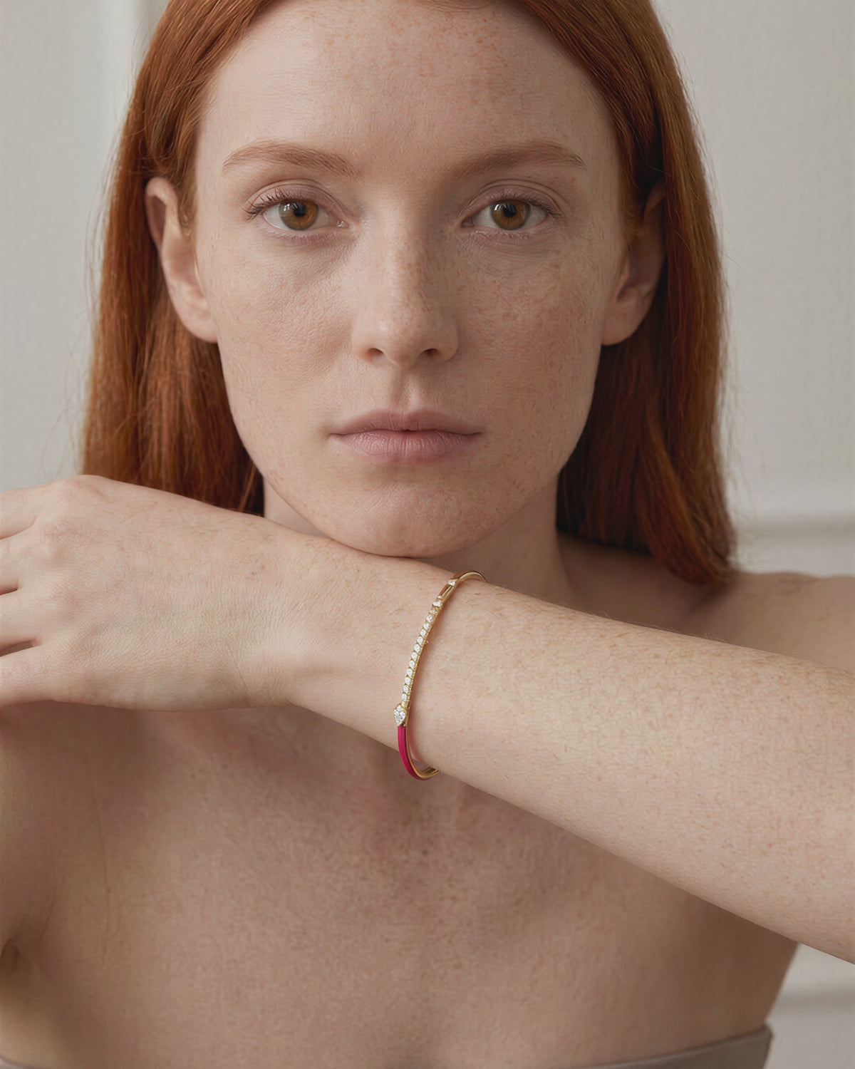 Rainbow Fuchsia single-line bracelet worn on model