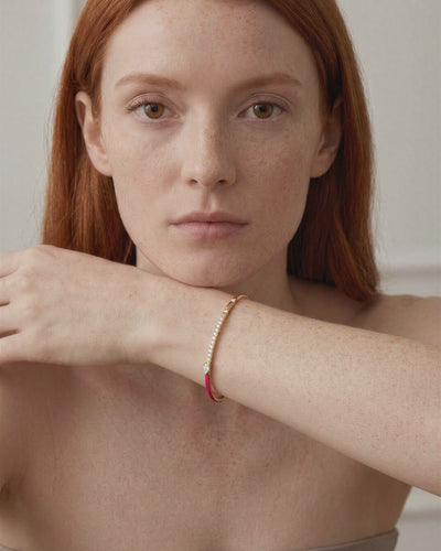 Rainbow Fuchsia single-line bracelet worn on model